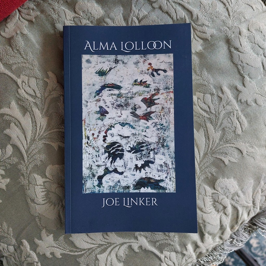 Copy of "Alma Lolloon" by Joe Linker, book on pillow, its cover an untitled abstract painting by Joe of bird and fish shapes floating.